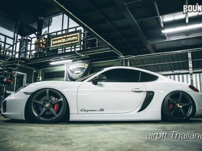 Supercar white Porsche 911 lowered low altitude speeding