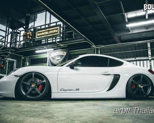 Supercar white Porsche 911 lowered low altitude speeding